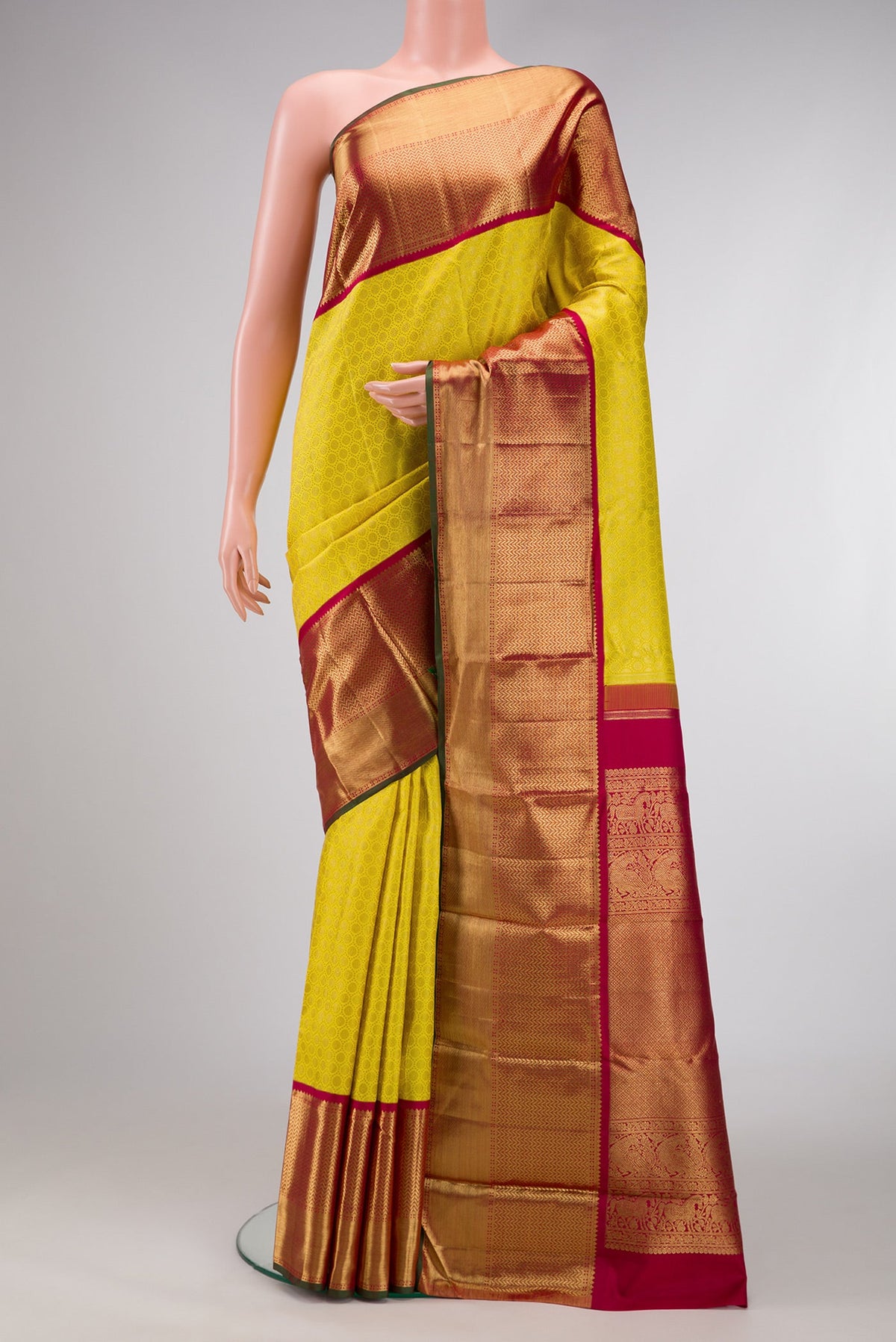 Pure Silk Pure Zari Parrot Green Dual Tone Kanjivaram Saree with Zari Brocade on the body and Zari Border.  displayed on a mannequin