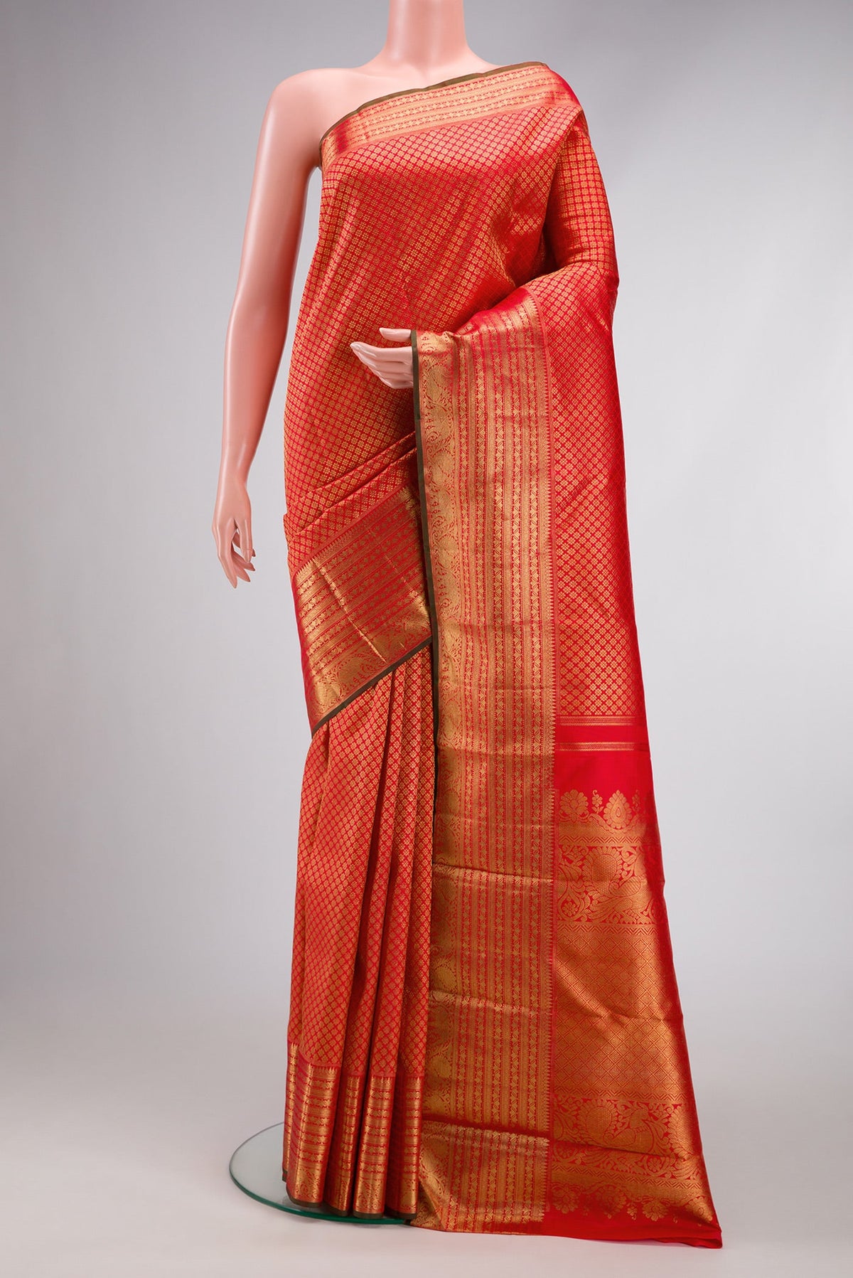 Pure Silk Pure Zari Red Kanjivaram Saree with Zari Brocade on the body and Zari Border.  displayed on a mannequin