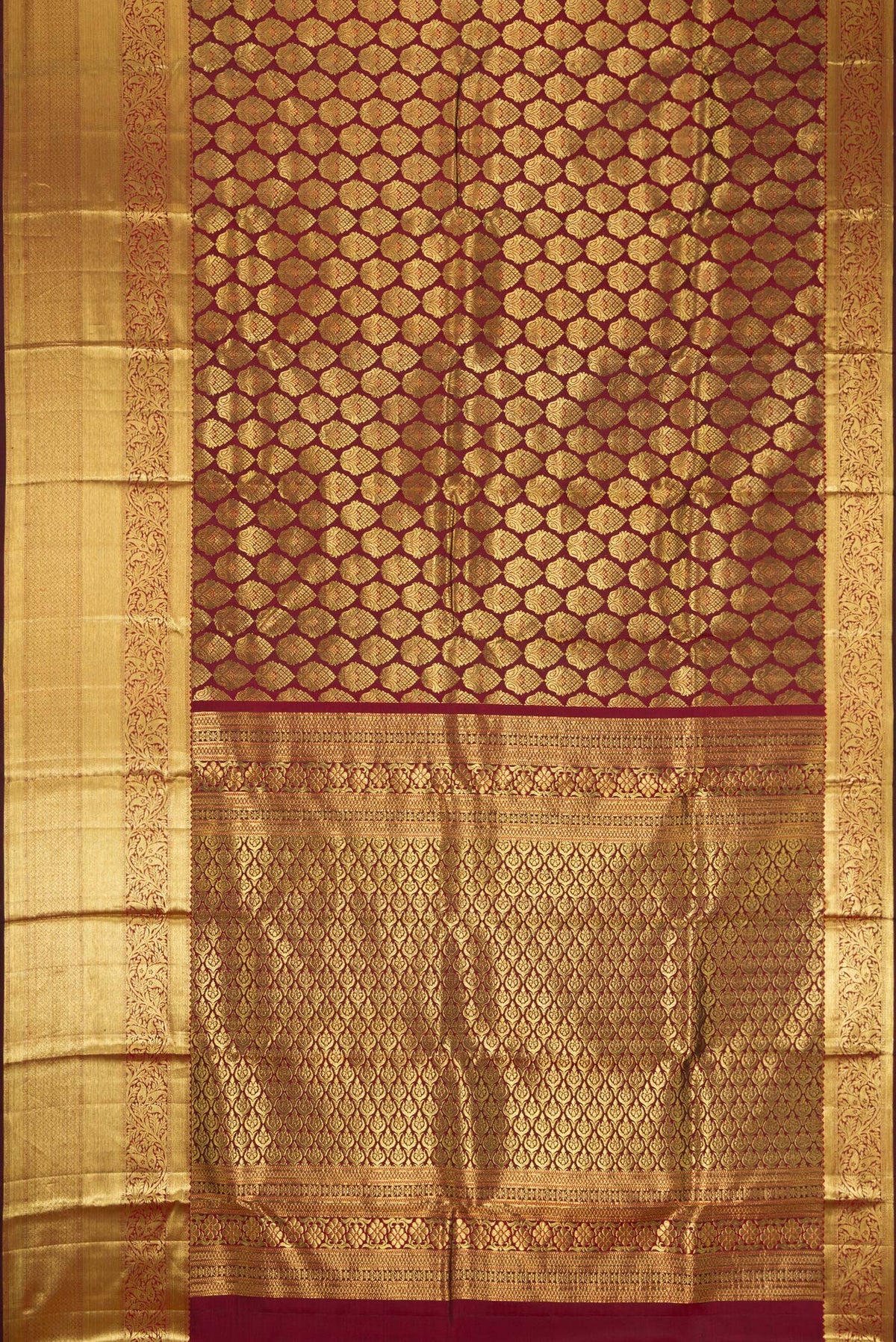 Flat view of Maroon Dual Tone Kanjivaram Silk Saree with Zari Brocade on the body and Zari Border. 