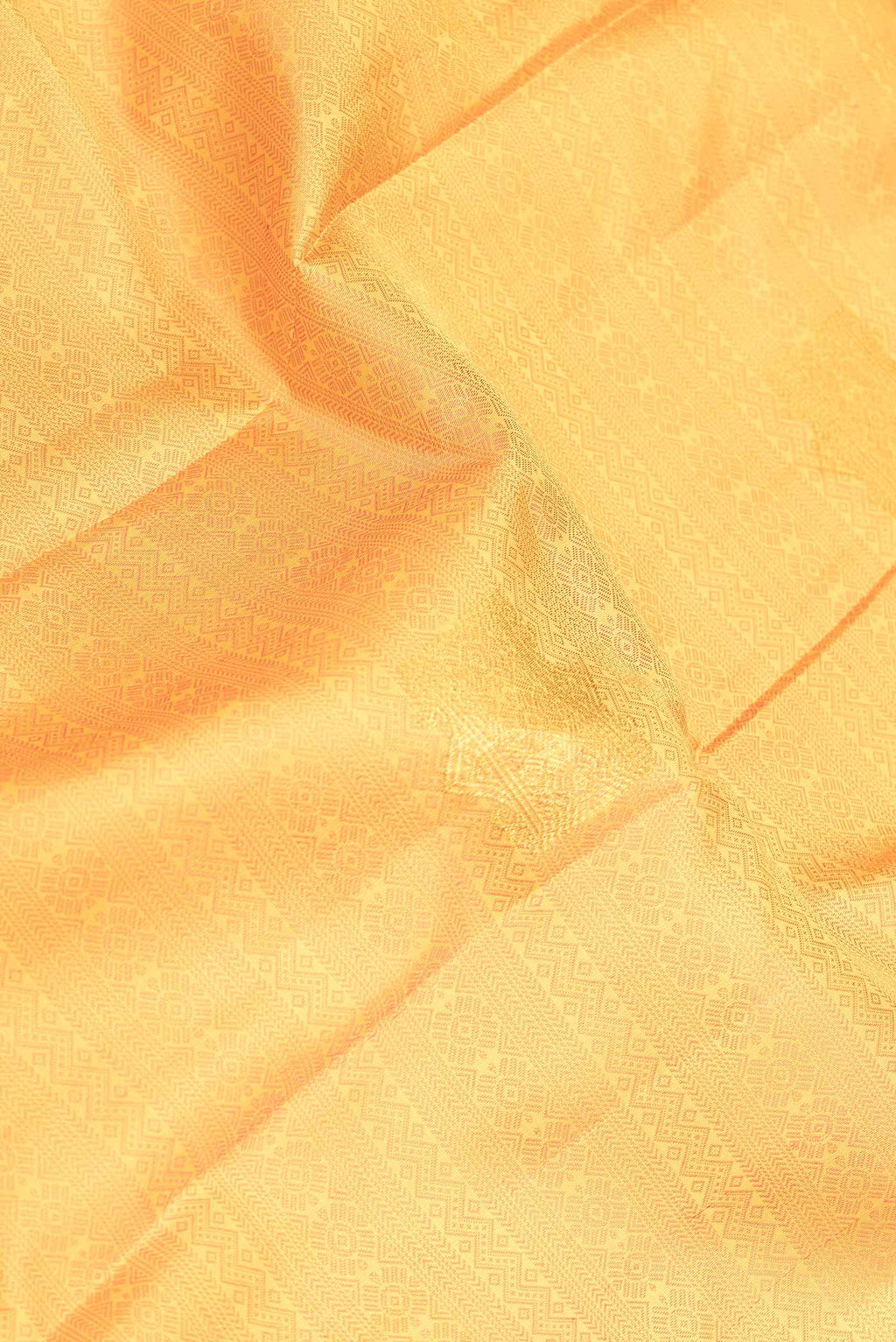 Close up of Yellow Dual Tone Kanchipuram Silk Saree with Jacquard With Zari Butta on the body and Zari Border displaying folds