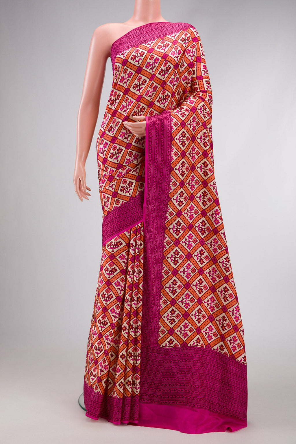Sandal Dual Tone Mysore Crepe Saree with Printed design on the body and Printed Border.  displayed on a mannequin