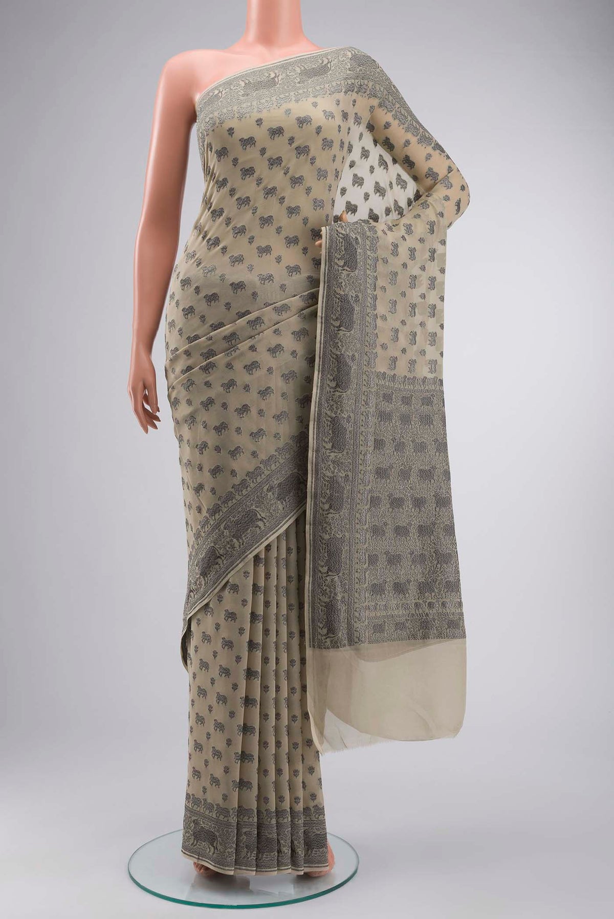 Beige Banarasi Georgette Saree with Zari Butta on the body and Zari Border displayed on a mannequin