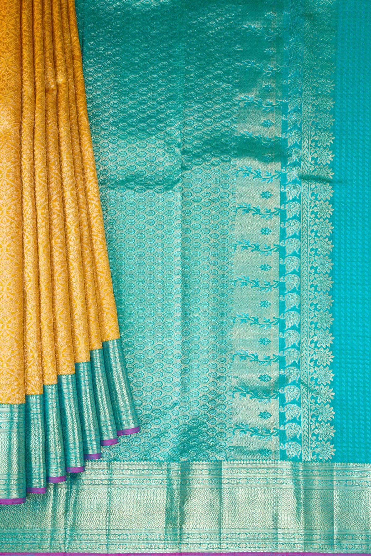 Pleats and pallu of Mustard Dual Tone Kanchipuram Silk Saree with Zari Brocade on the body and Zari Border. 