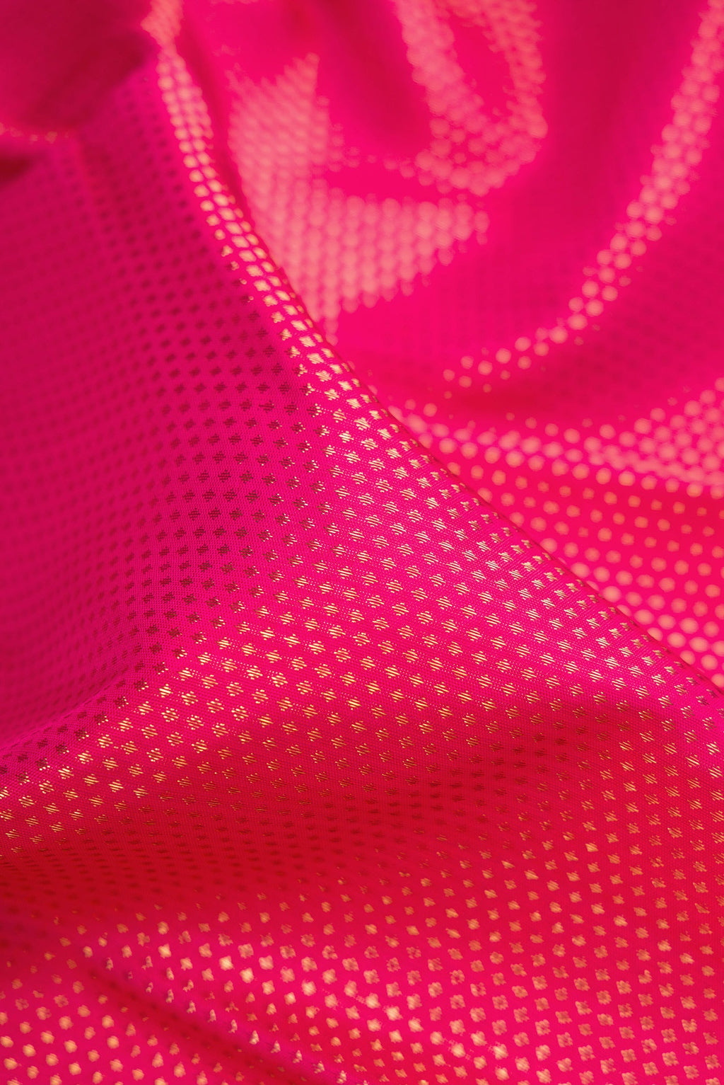 Close up of Pure Silk Pure Zari Pink Dual Tone Kanjivaram Saree with Zari Brocade on the body and Zari Border.  displaying folds