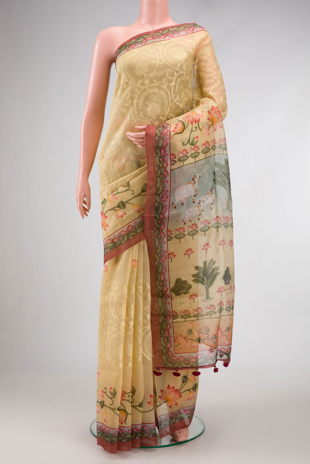 Sandal Dual Tone Organza Silk Saree with Embroidery on the body and Printed Border.  displayed on a mannequin