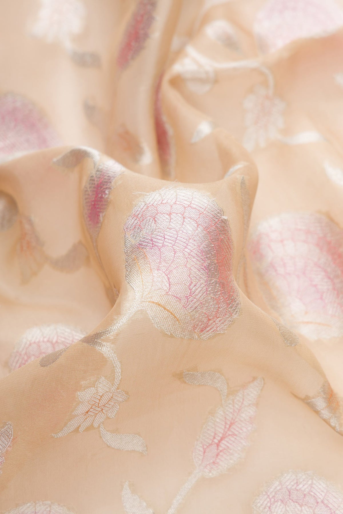 Close up of Sandal Dual Tone Organza Silk Saree with Zari Brocade on the body and Zari Border.  displaying folds