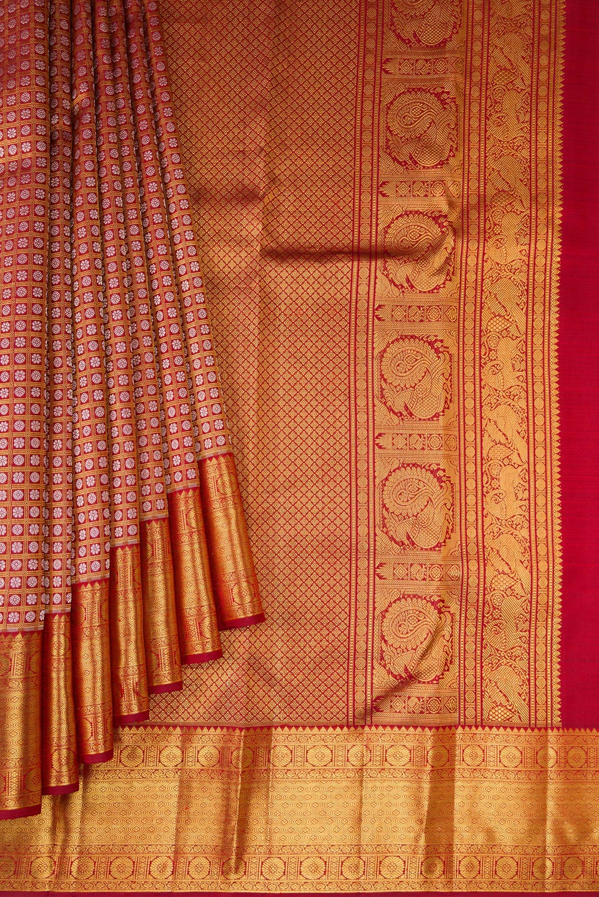 Pleats and pallu of Maroon Kanchipuram Silk Saree with Zari Brocade on the body and Zari Border. 