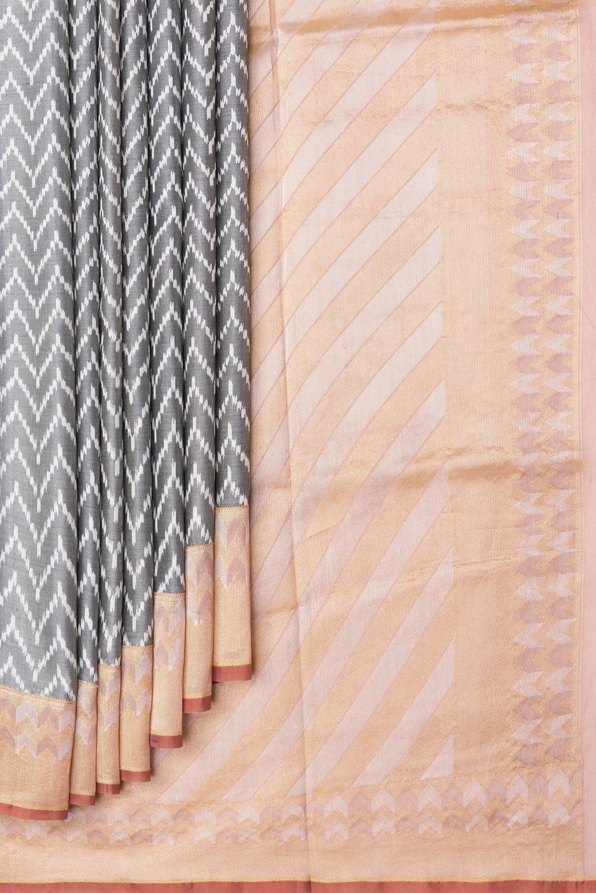 Pleats and pallu of Grey Dual Tone Double Ikat Saree with Ikat Print on the body and Zari Border. 