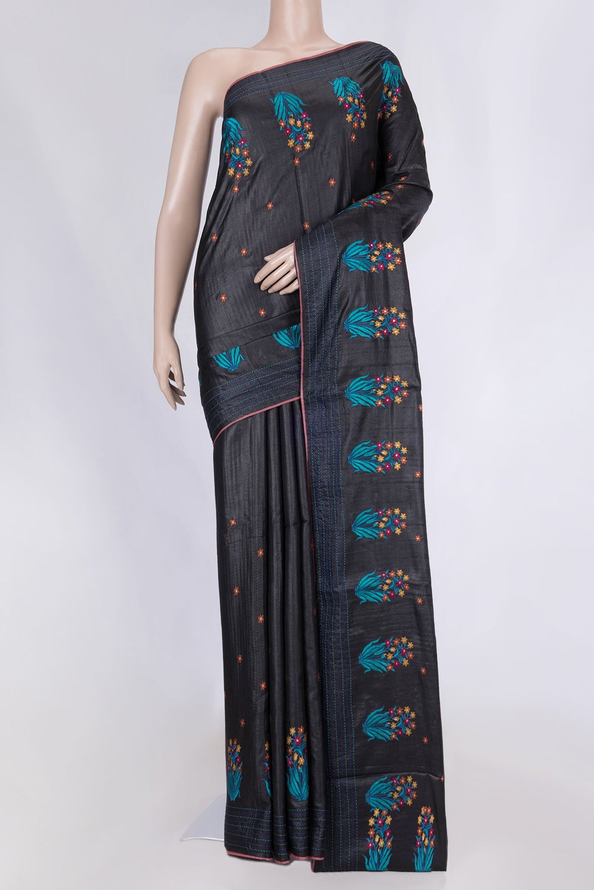 Black Tussar Silk Saree with Embroidery on the body and Embroidery Border displayed on a mannequin