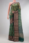 Green Dual Tone Organza Silk Saree with Printed design on the body and Zari Border.  displayed on a mannequin