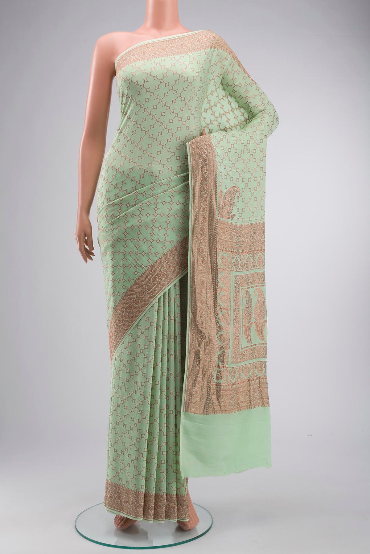 Green Banarasi Georgette Saree with Zari Butta on the body and Zari Border displayed on a mannequin