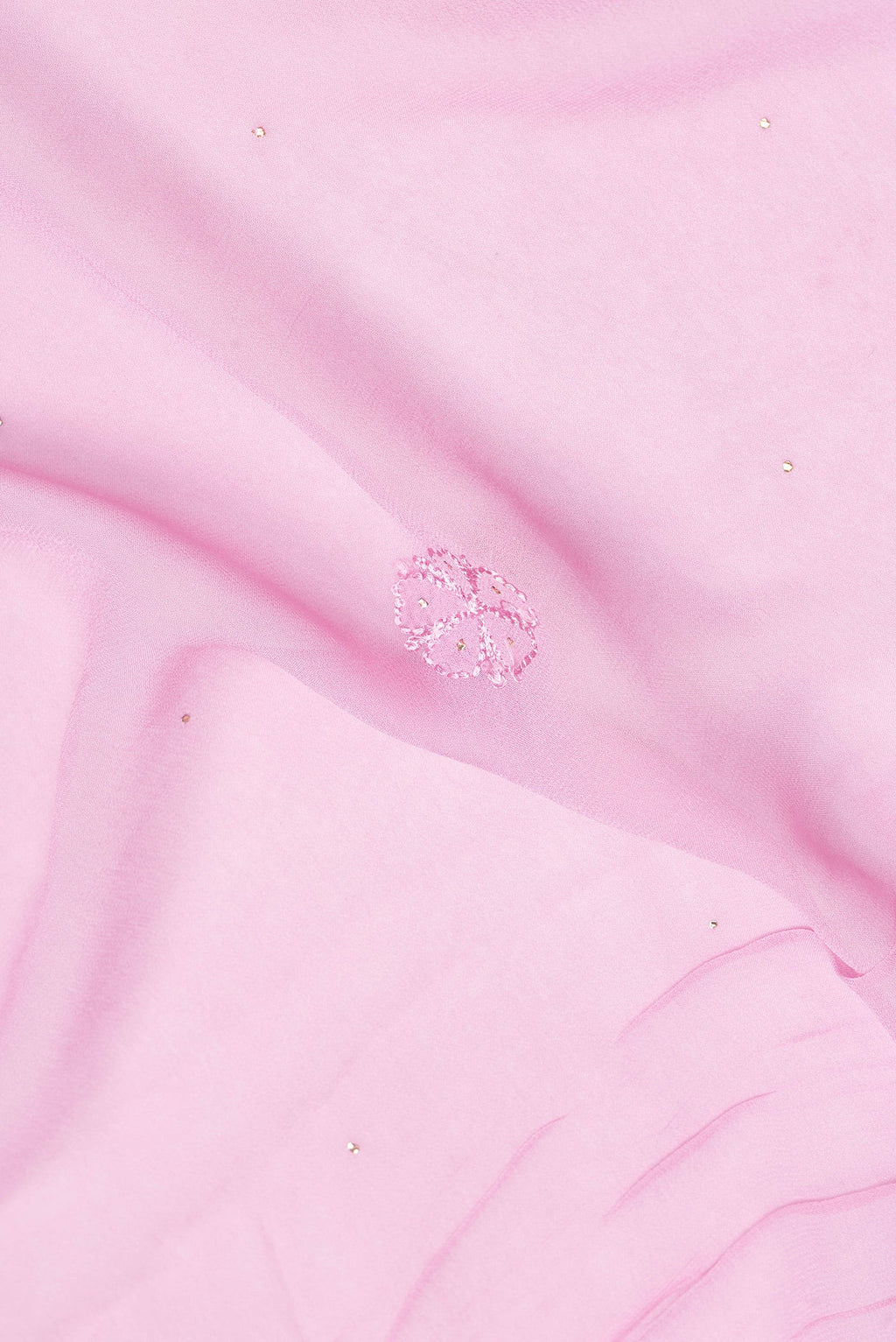 Close up of Pink Dual Tone Georgette Saree with Embroidery on the body and Embroidery Border.  displaying folds