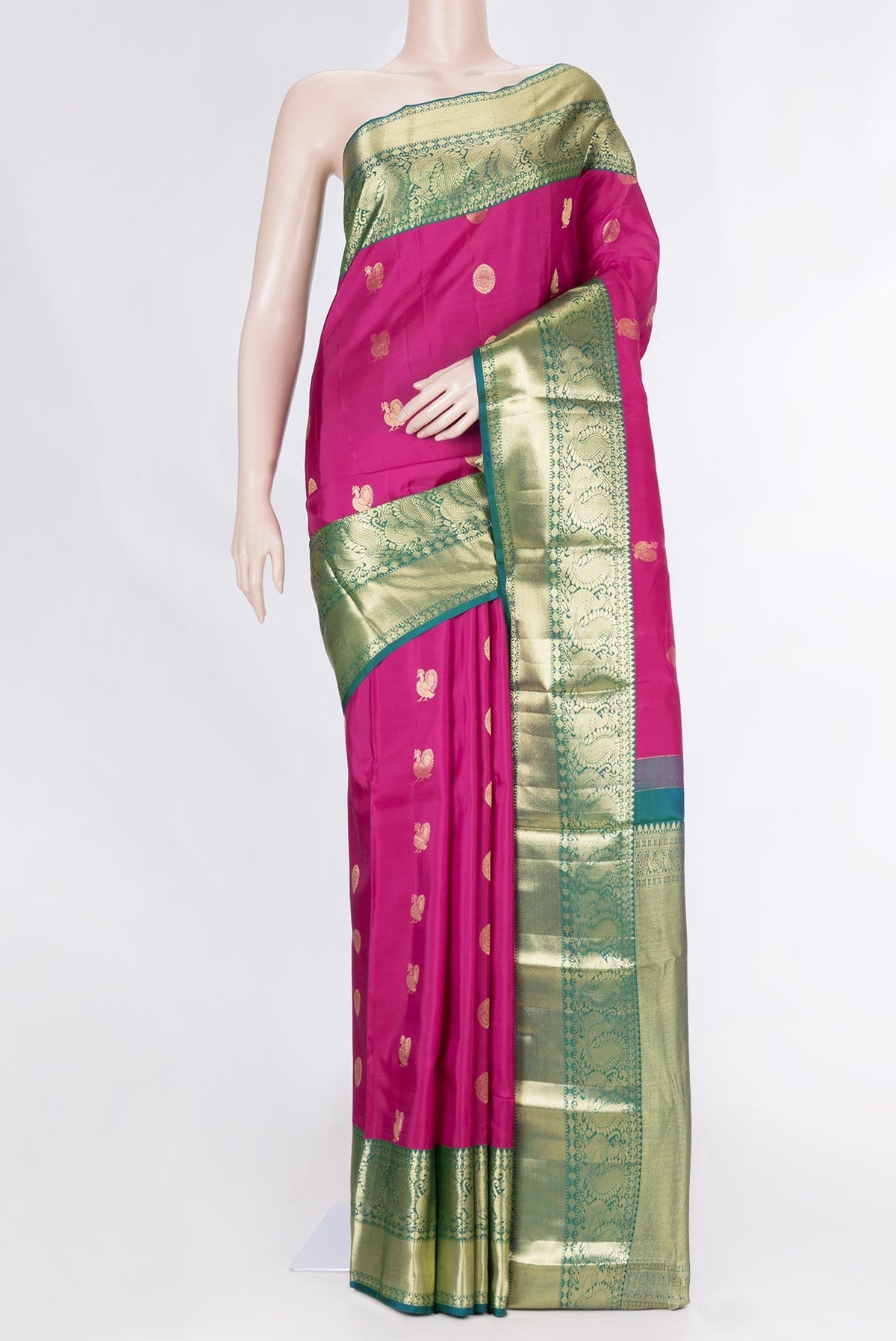 Magenta Dual Tone Kanchipuram Saree with Zari Butta on the body and Zari Border displayed on a mannequin