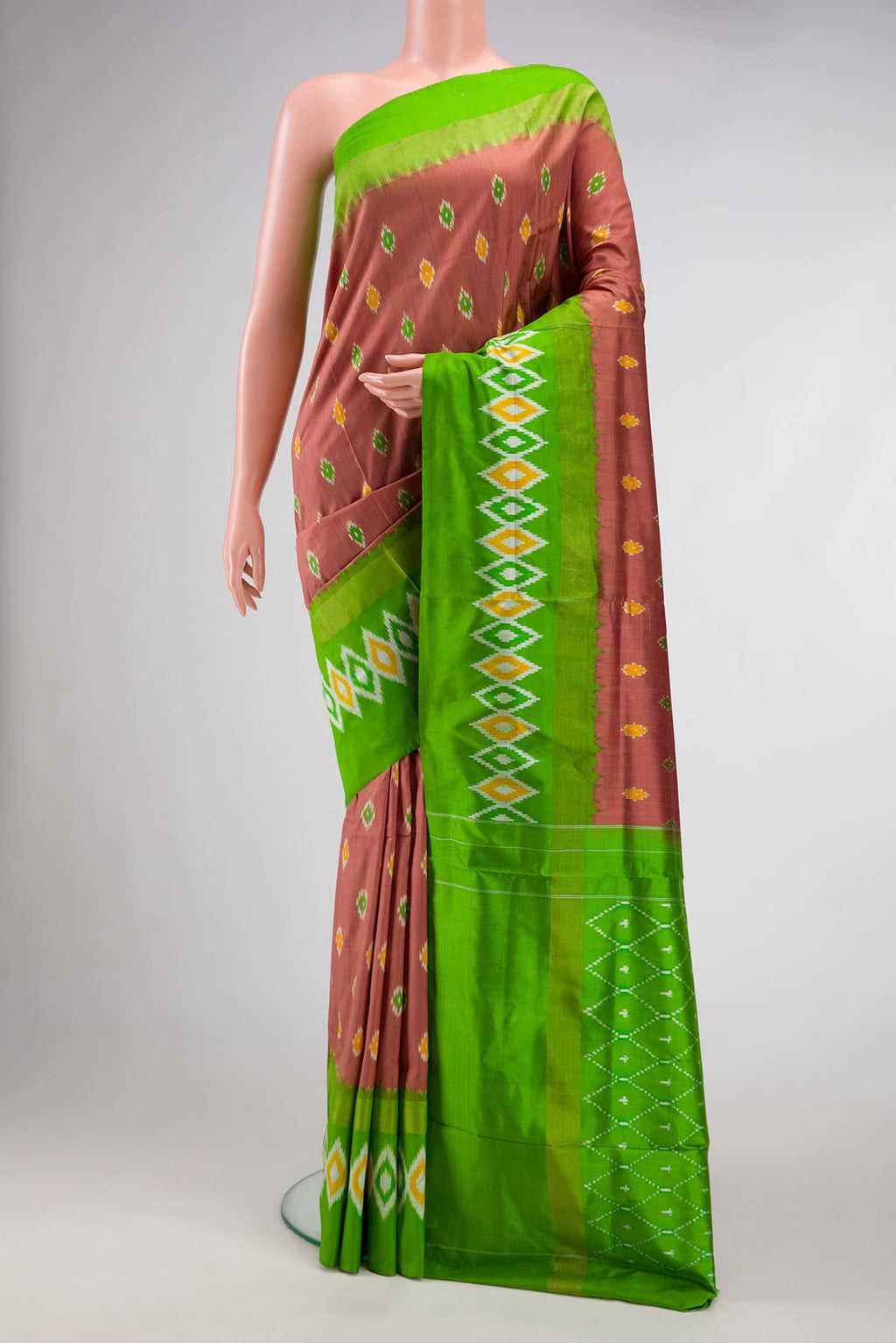 Brown Dual Tone Double Ikat Saree with Ikat Print on the body and Ikat Border.  displayed on a mannequin