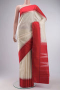 Cream Kanchipuram Silk Saree with Plain Body and Temple Border displayed on a mannequin