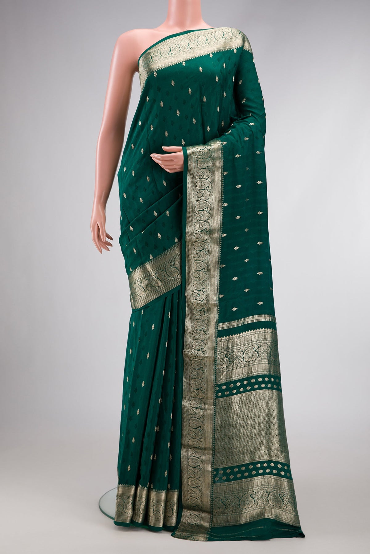 Bottle Green Dual Tone Mysore Georgette Saree with Zari Butta on the body and Zari Border.  displayed on a mannequin