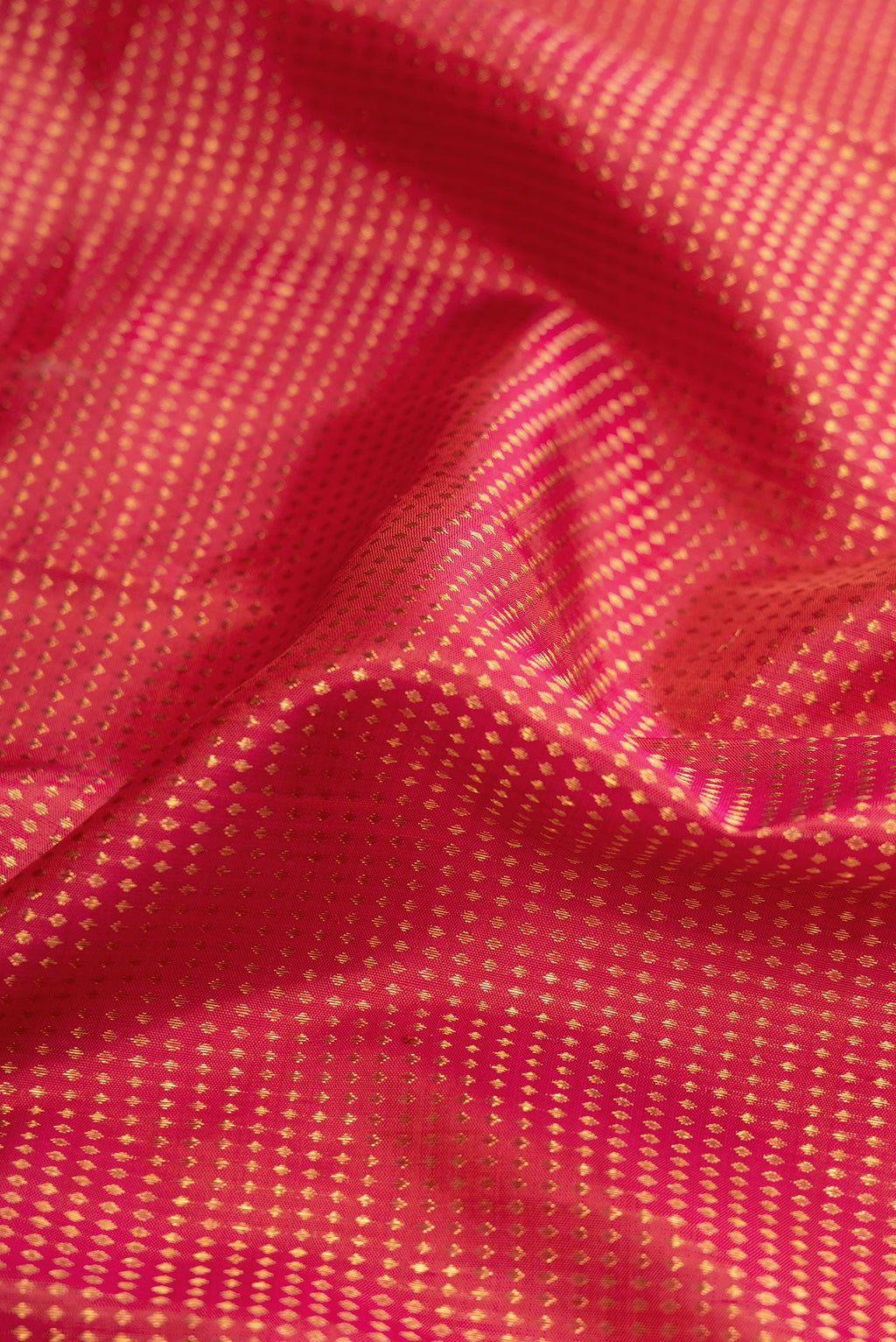 Close up of Dark Pink Dual Tone Kanjivaram Silk Saree with Stripes on the body and Zari Border.  displaying folds