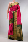 Dark Pink Dual Tone Kanjivaram Silk Saree with Stripes on the body and Zari Border.  displayed on a mannequin