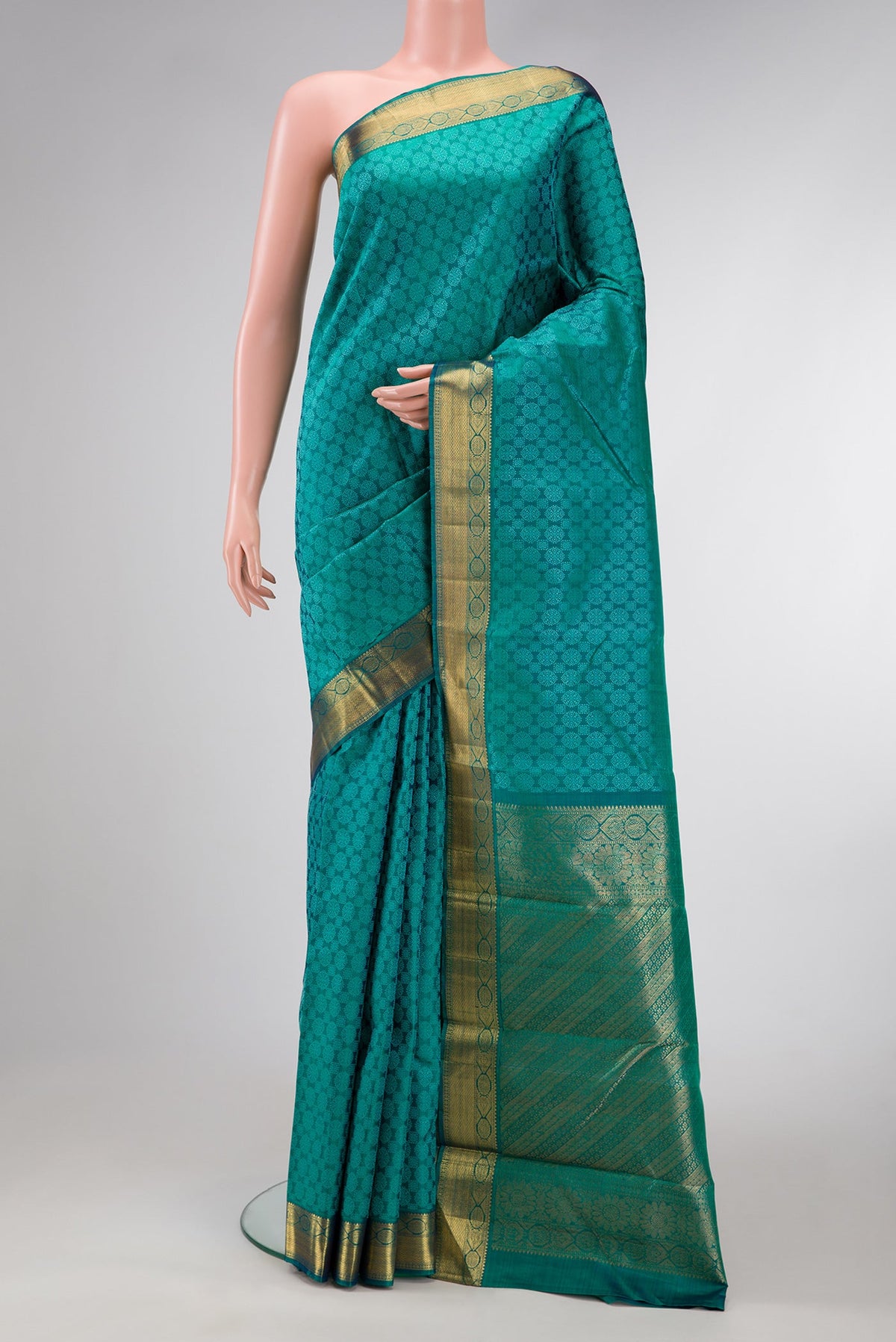 Peacock Blue Dual Tone Kanjivaram Silk Saree with Jacquard design on the body and Zari Border.  displayed on a mannequin