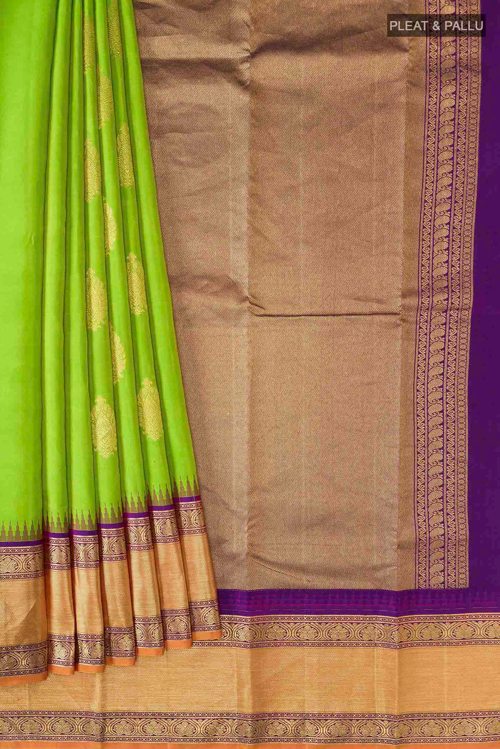 Pleats and pallu of Green Kanchipuram Silk Saree with Zari Butta on the body and Zari Border