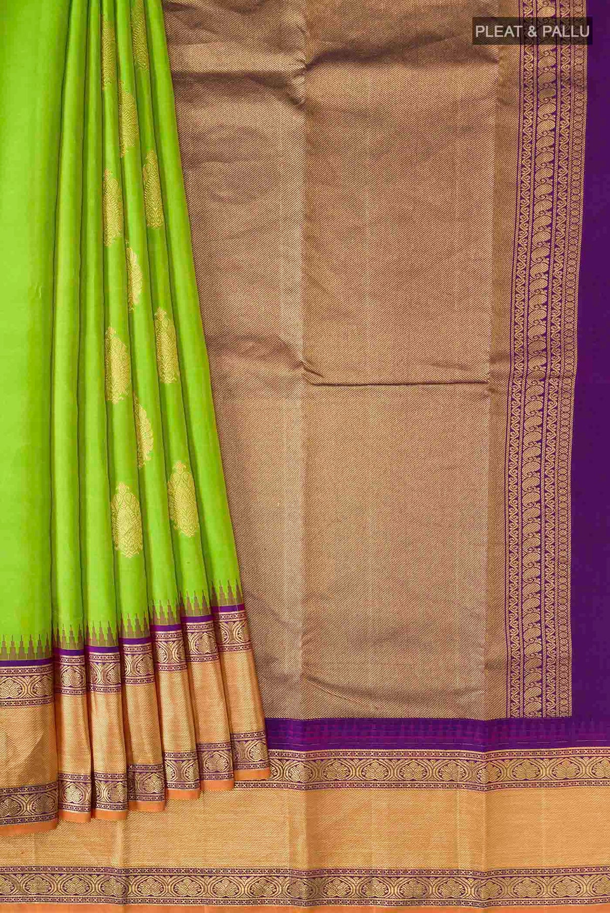 Pleats and pallu of Green Kanchipuram Silk Saree with Zari Butta on the body and Zari Border