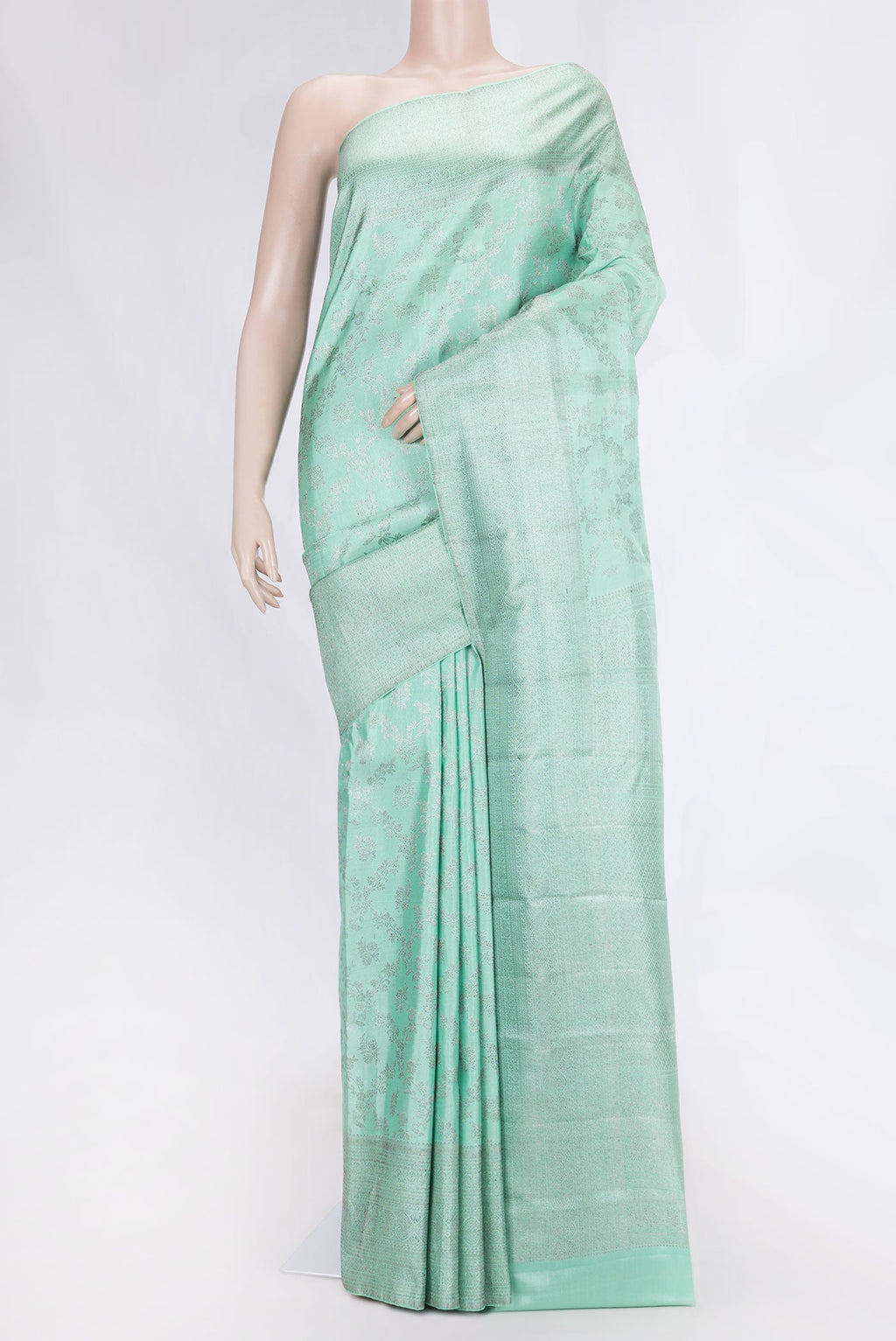 Sea Green Dual Tone Kanchipuram Silk Saree with Zari Brocade on the body and Zari Border displayed on a mannequin