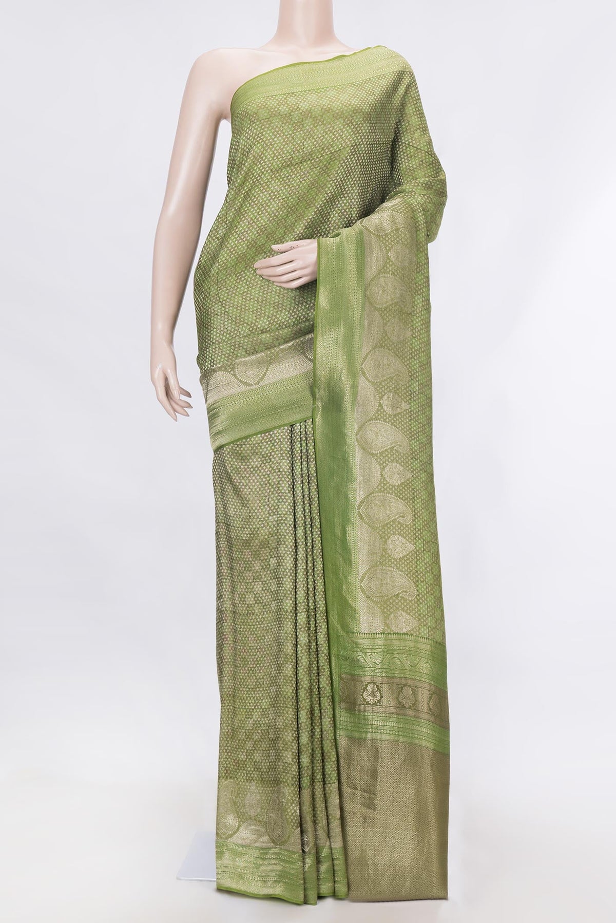 Green Dual Tone Mysore Georgette Saree With Printed design on the body and Zari Border displayed on a mannequin
