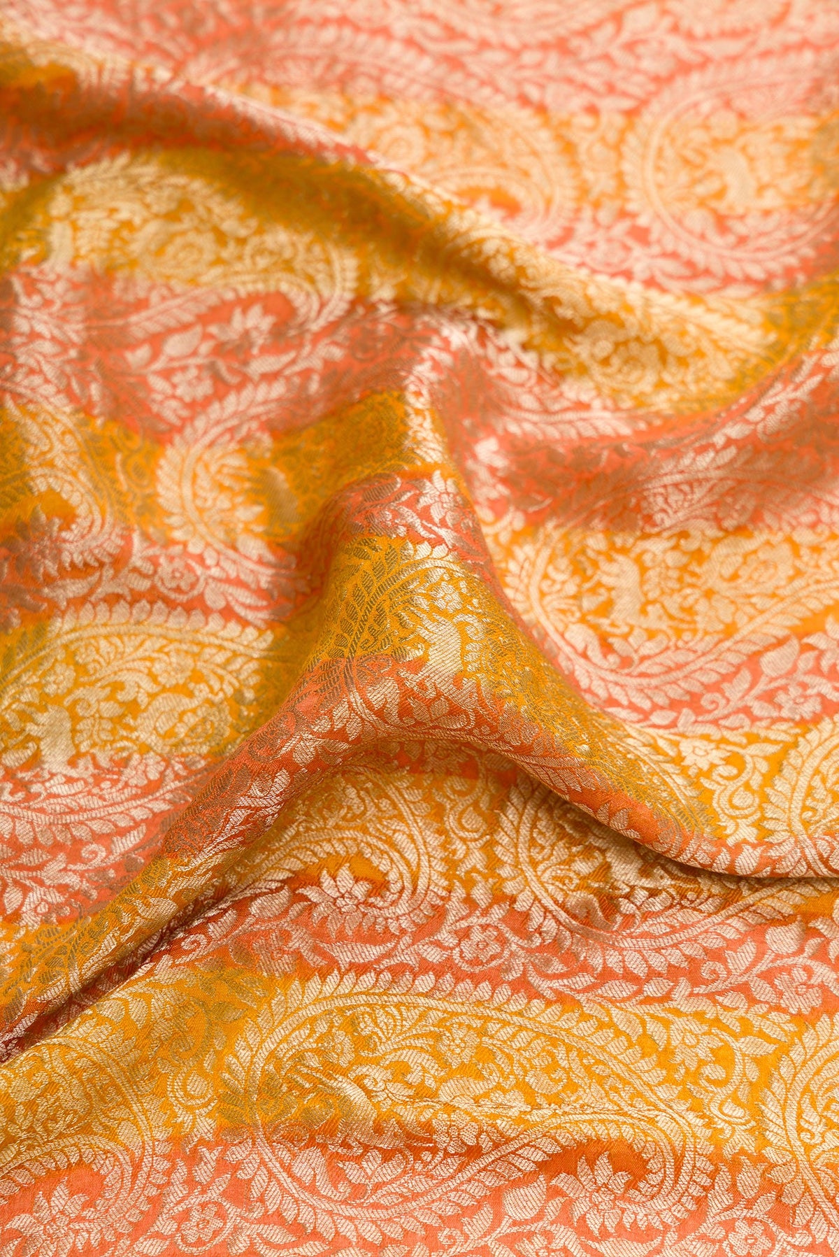 Close up of Mustard Dual Tone Tussar Silk Saree with Zari Brocade on the body and Zari Border.  displaying folds