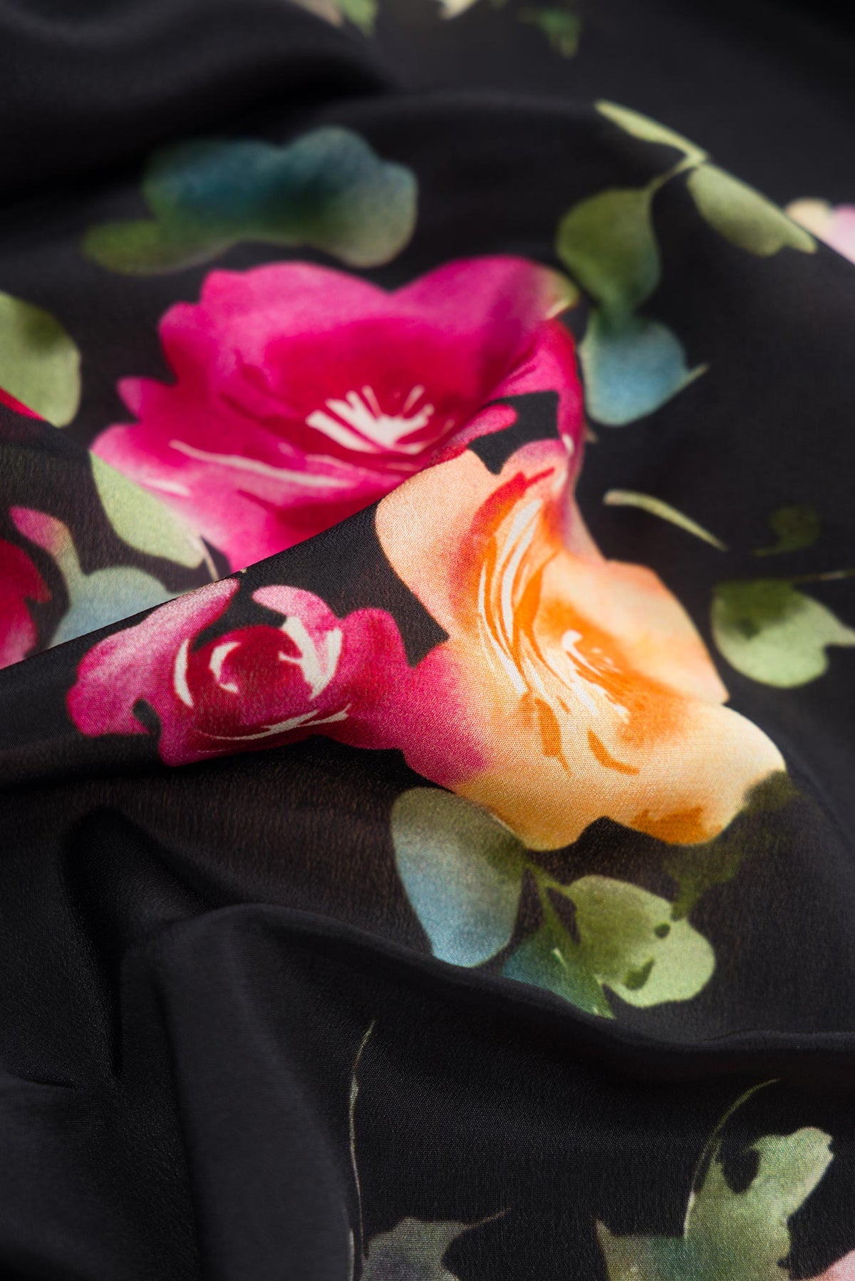Close up of Black Dual Tone Mysore Crepe Saree with Printed design on the body and Without Border.  displaying folds