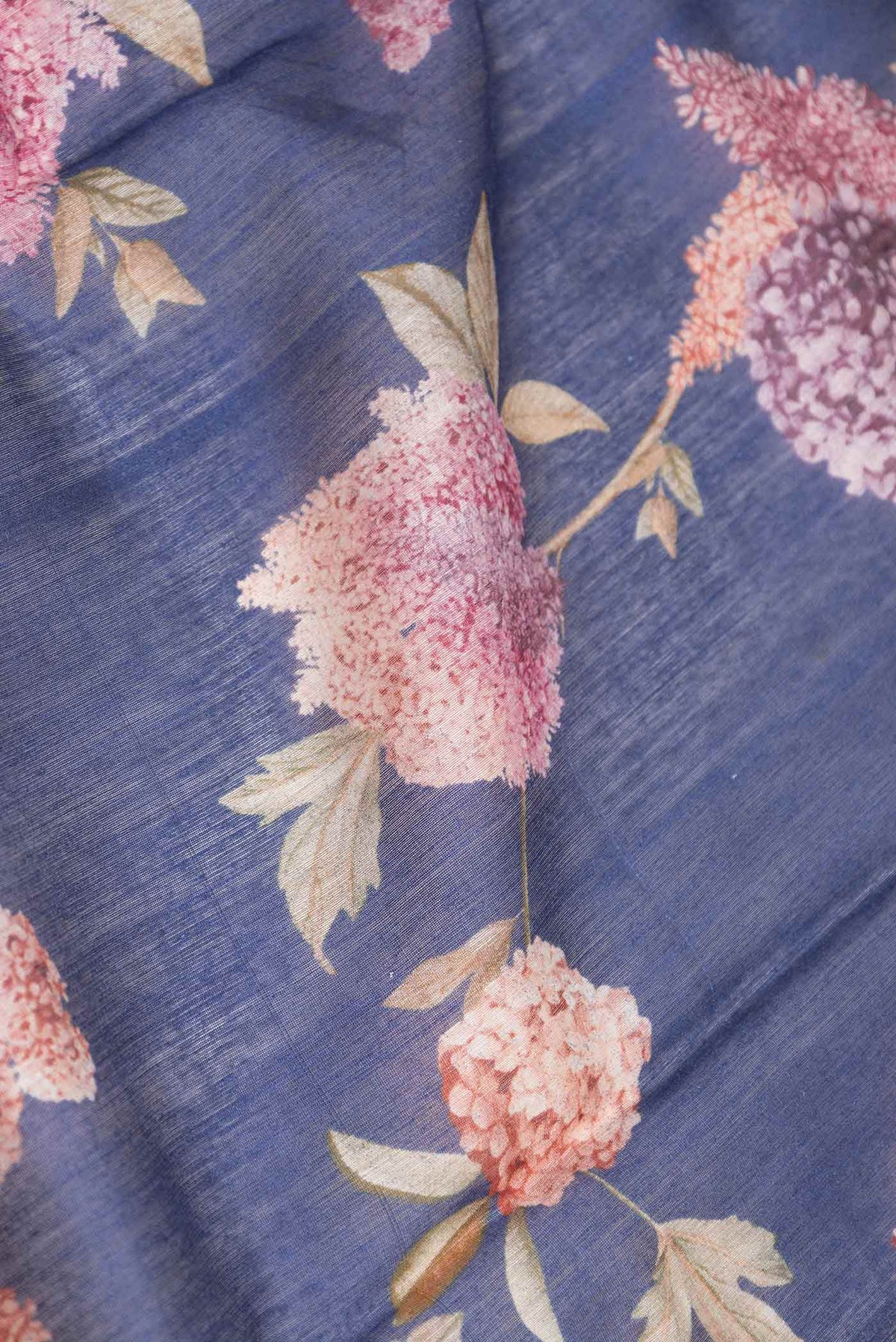 Close up of Navy Blue Dual Tone Chanderi Silk Saree with Printed design on the body and Zari Border displaying folds