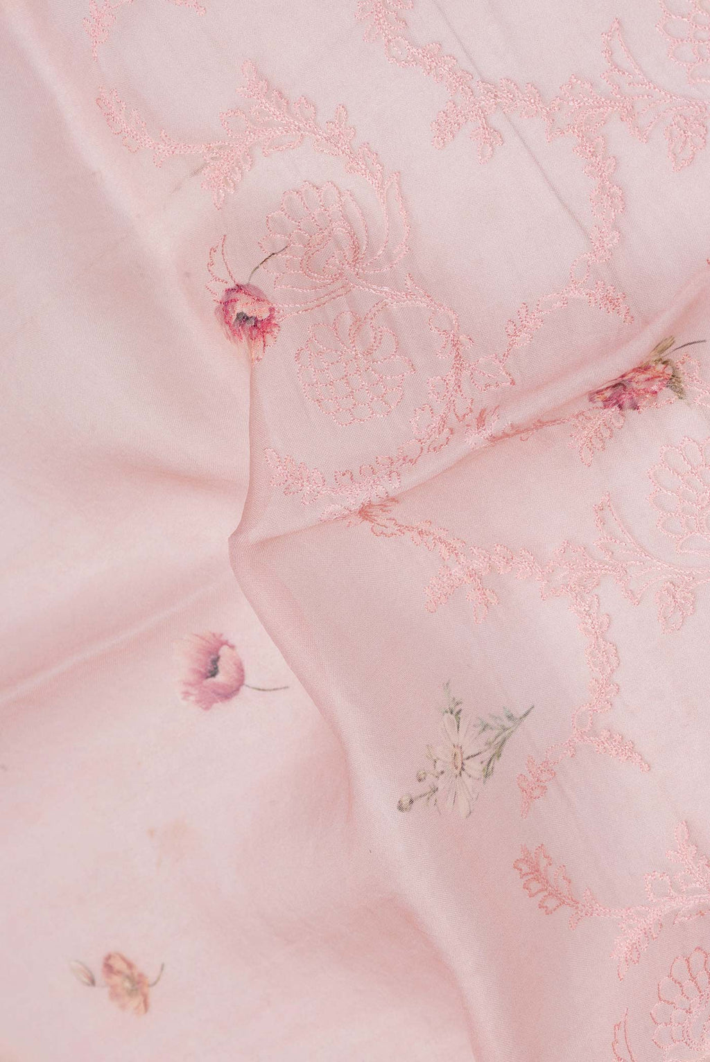 Close up of Pink Dual Tone Organza Silk Saree with Embroidery on the body and Embroidery Border displaying folds