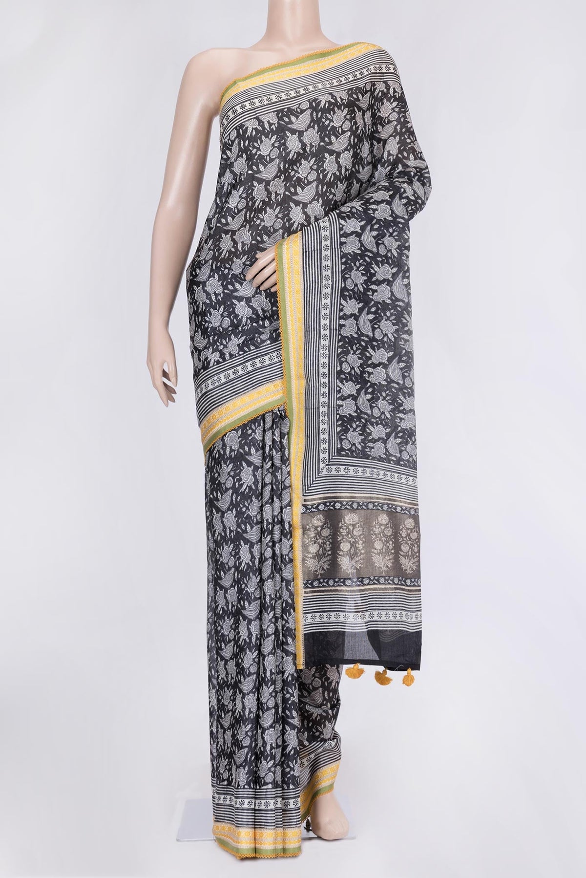 Black Dual Tone Tussar Silk Saree with Printed design on the body and Embroidery Border.  displayed on a mannequin