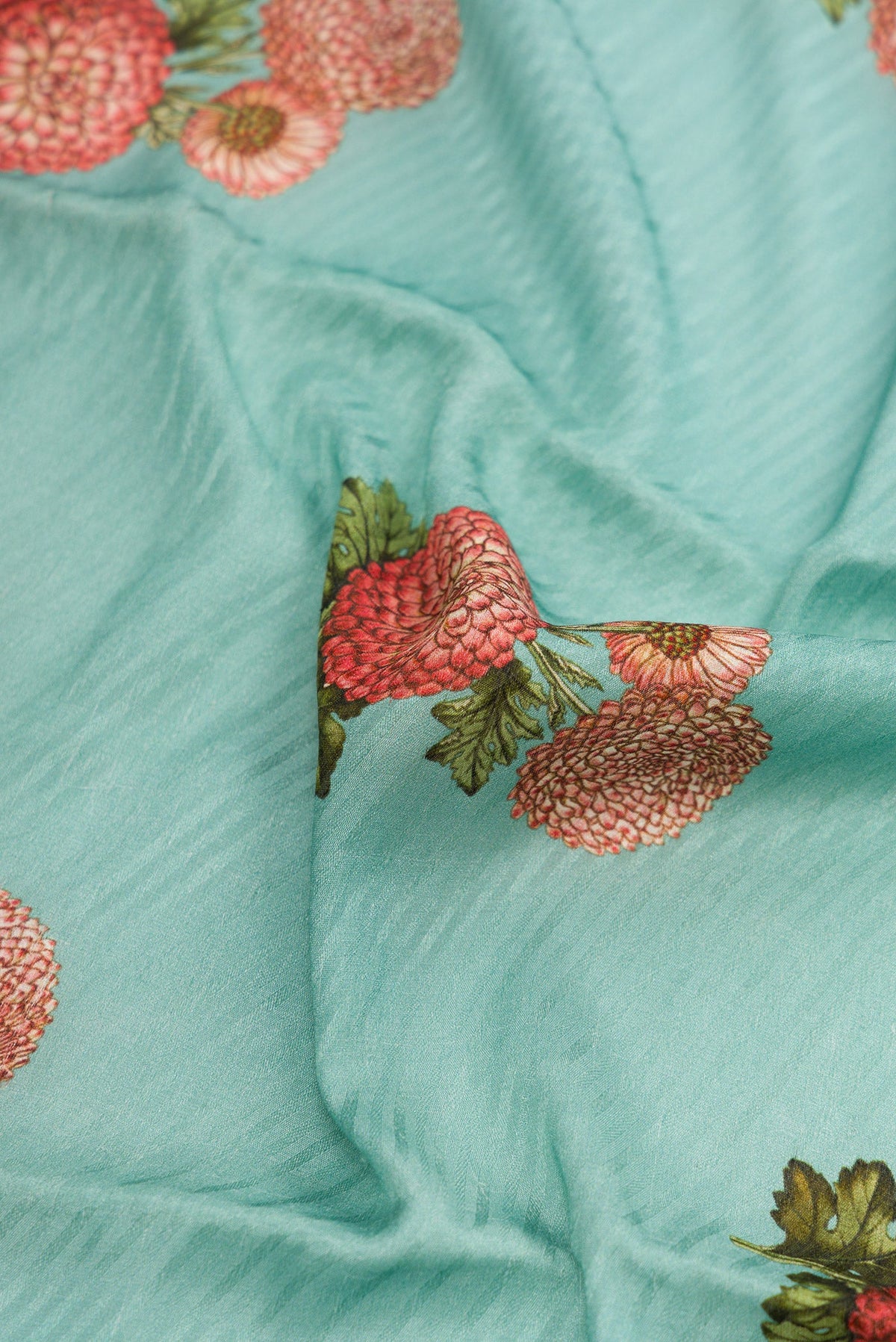 Close up of Light Blue Dual Tone Tussar Silk Saree with Printed design on the body and Zari Border.  displaying folds