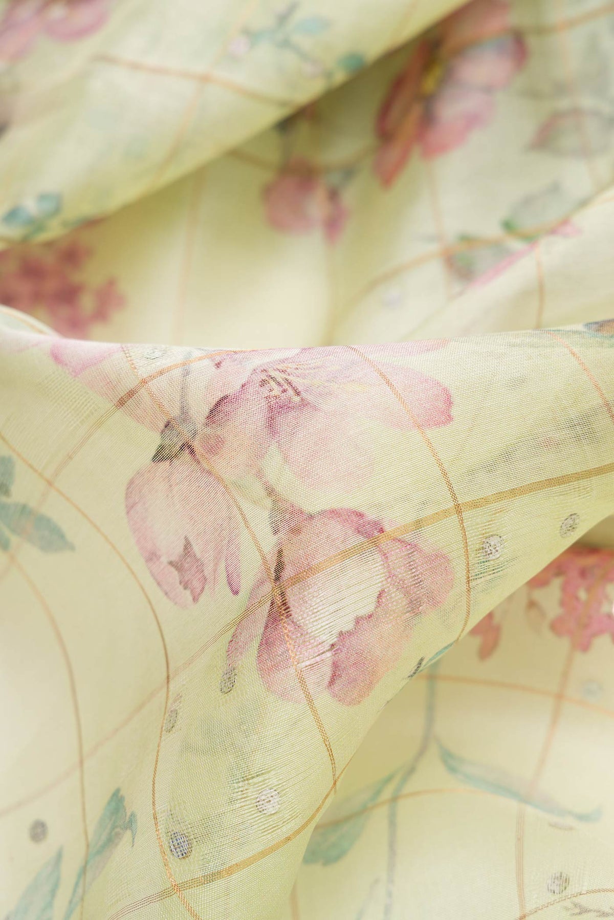 Close up of Pista Green Dual Tone Tussar Silk Saree with Zari Butta on the body and Zari Border.  displaying folds