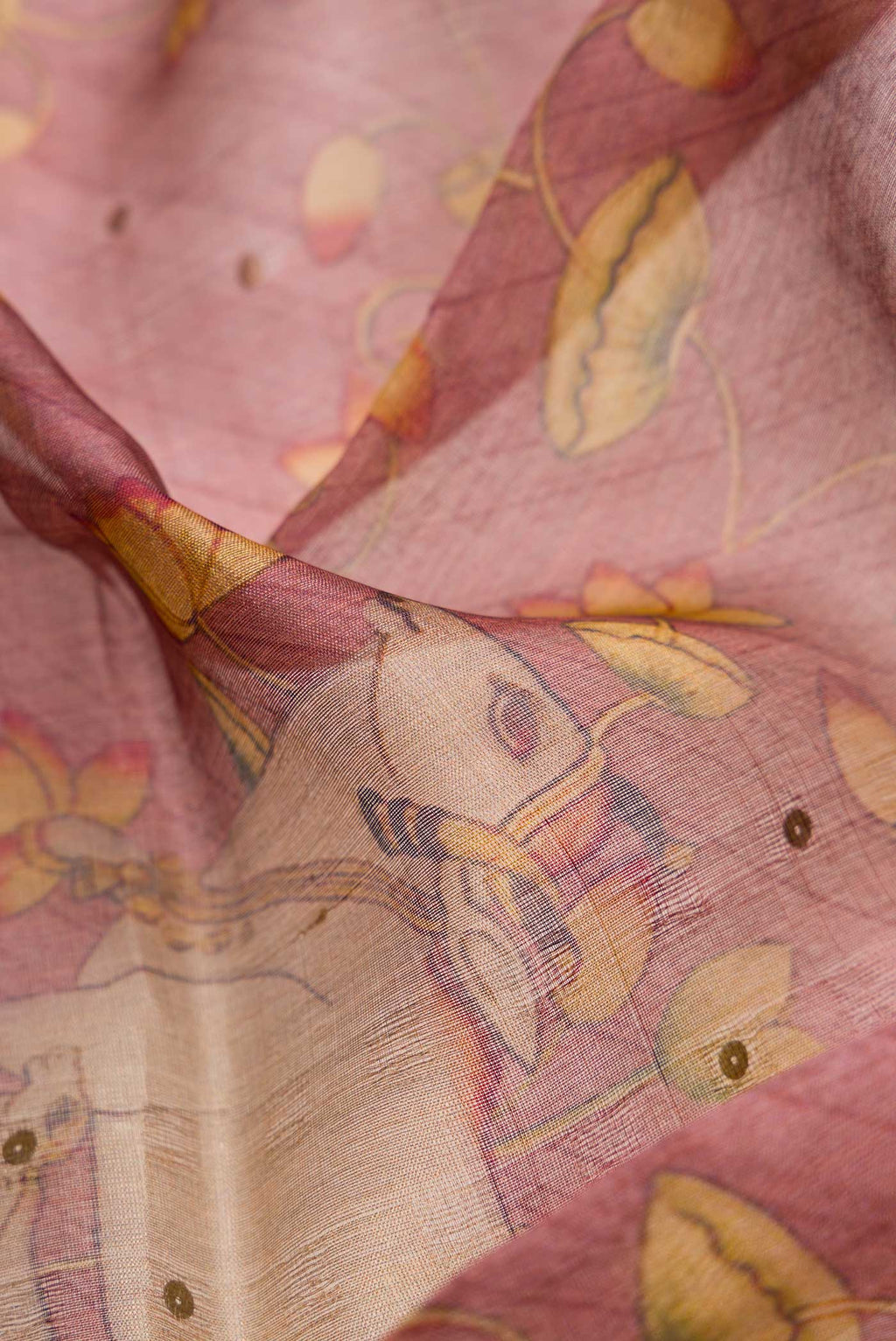 Close up of Pink Dual Tone Tussar Silk Saree with Printed design on the body and Zari Border.  displaying folds