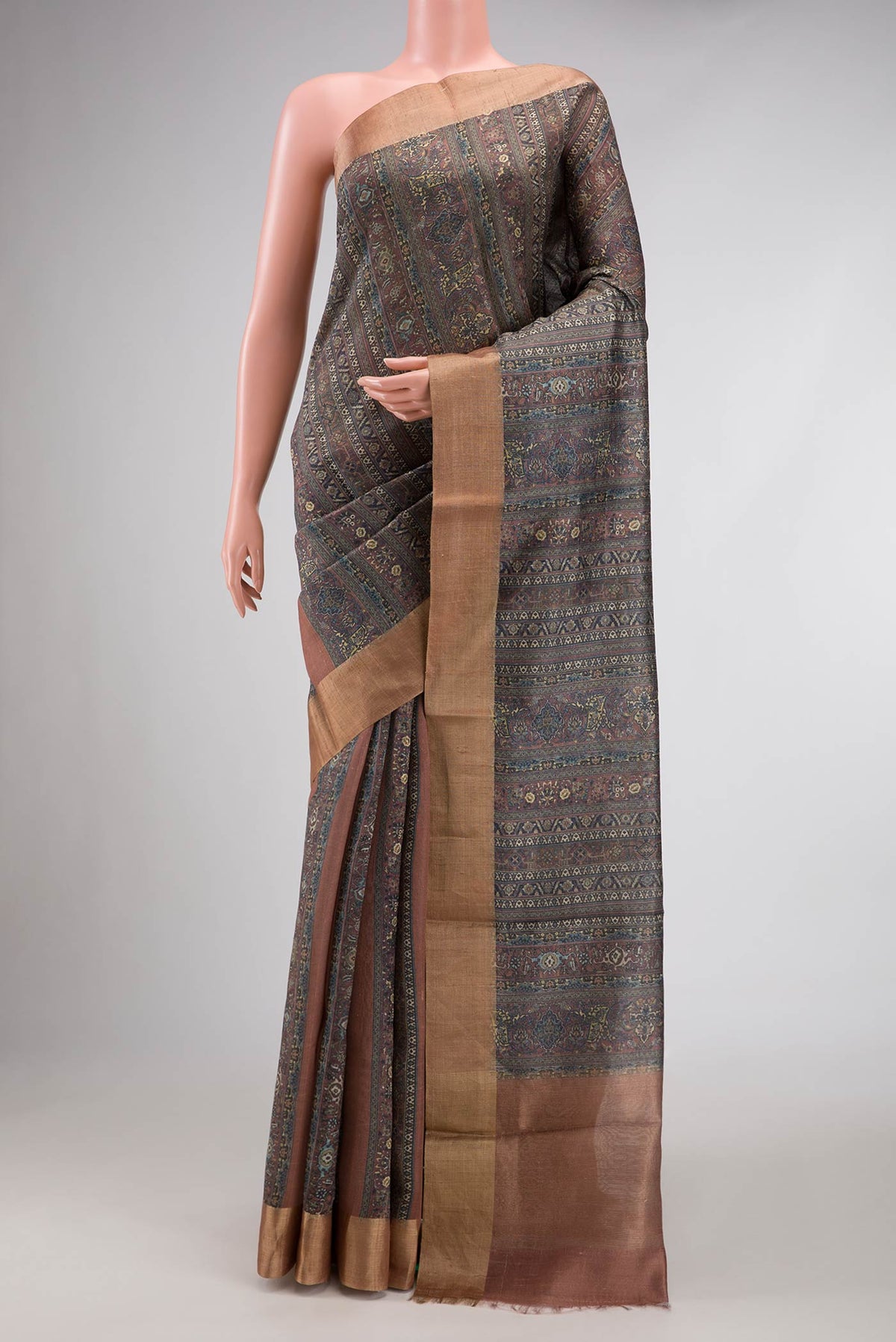 Grey Dual Tone Tussar Silk Saree with Printed design on the body and Zari Border.  displayed on a mannequin
