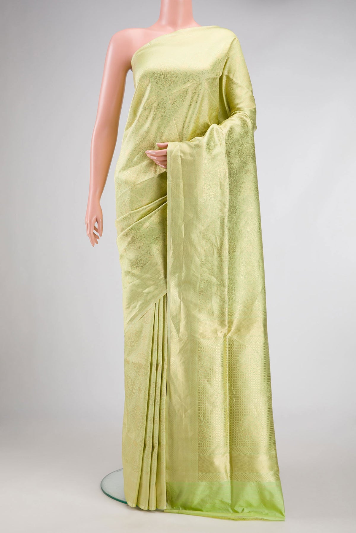 Pista Green Dual Tone Banarasi Silk Saree with Zari Brocade on the body and Zari Border.  displayed on a mannequin