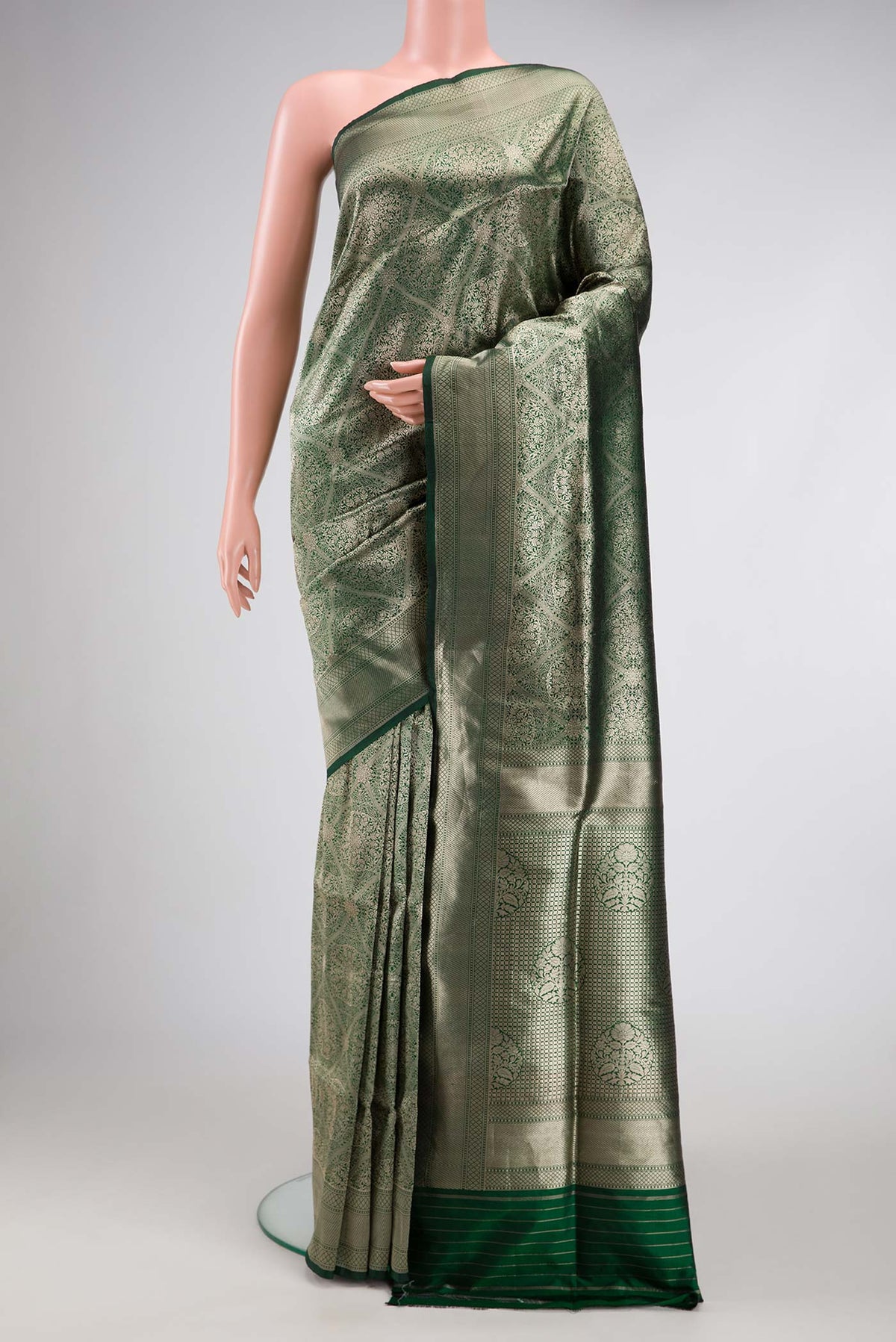 Bottle Green Dual Tone Banarasi Silk Saree with Zari Brocade on the body and Zari Border.  displayed on a mannequin