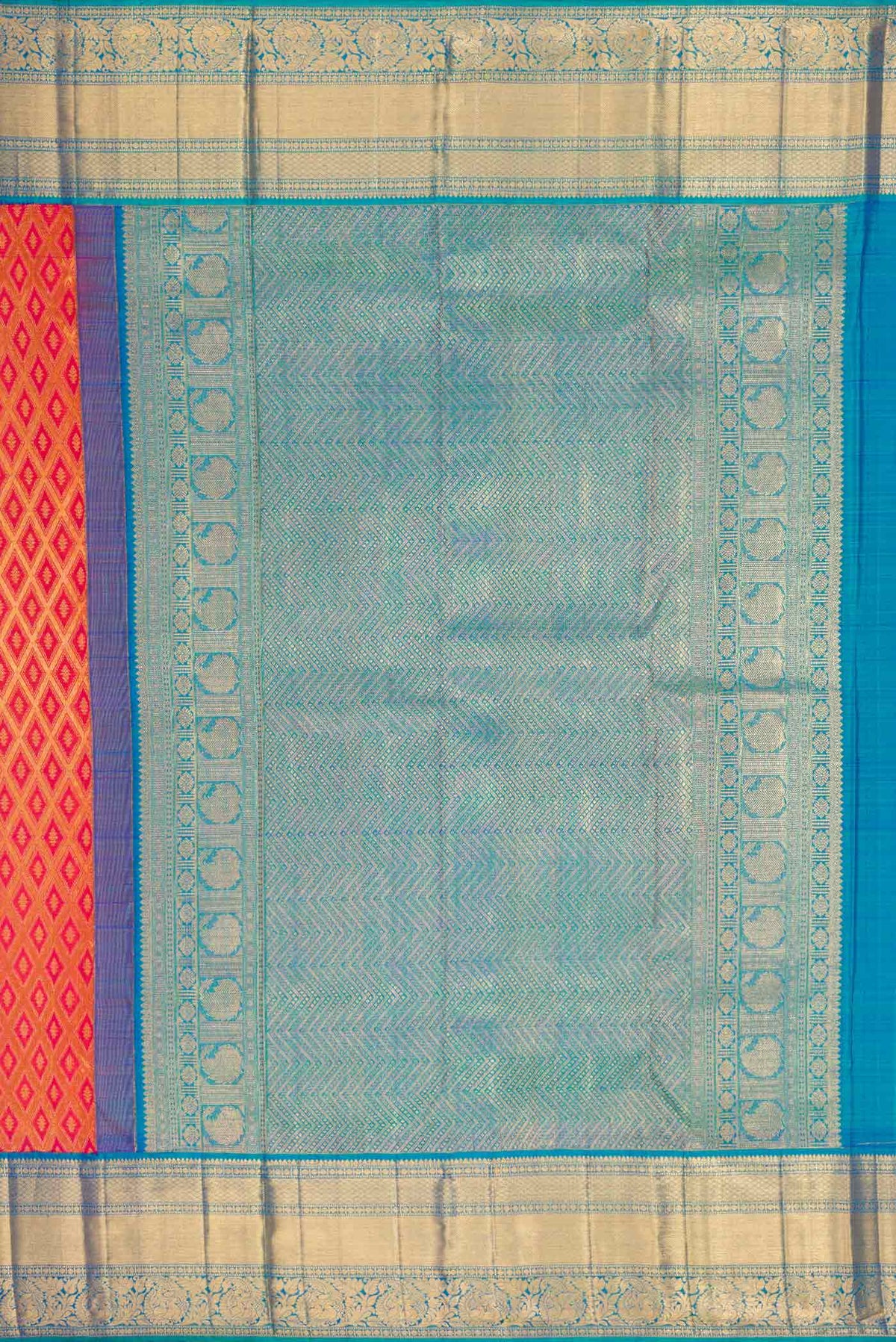 Close up image of the pallu of Brick Orange Dual Tone Kanchipuram Silk Saree with Zari Brocade on the body and Zari Border