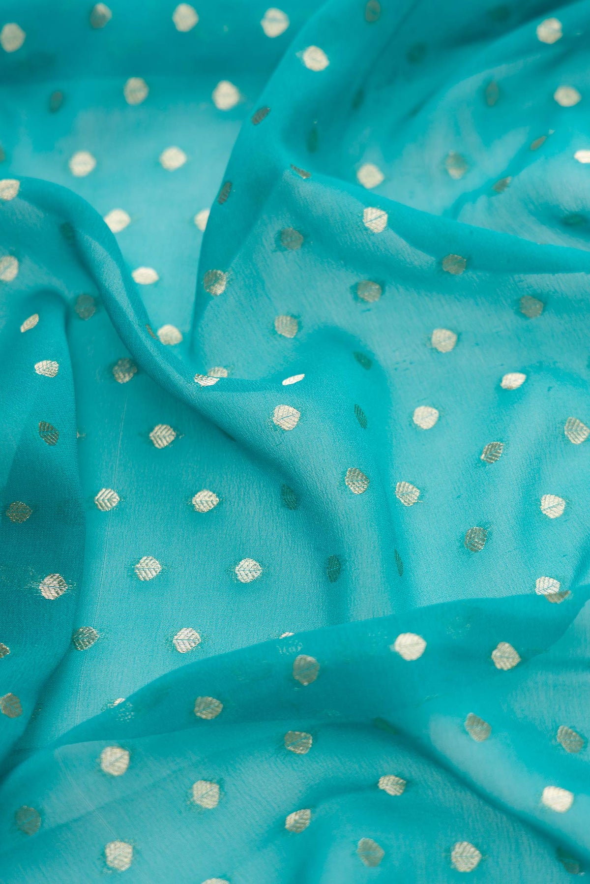 Close up of Sky Blue Dual Tone Banarasi Georgette Saree with Zari Butta on the body and Zari Border.  displaying folds