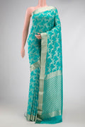 Sky Blue Dual Tone Banarasi Georgette Saree with Zari Brocade on the body and Zari Border.  displayed on a mannequin