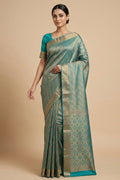 Model wearing a Sky Blue Mysore Crepe Saree with Zari Brocade on the body and Zari Border.