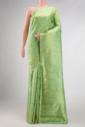 Pista Green Dual Tone Kanchipuram Silk Saree with Zari Brocade on the body and Zari Border displayed on a mannequin