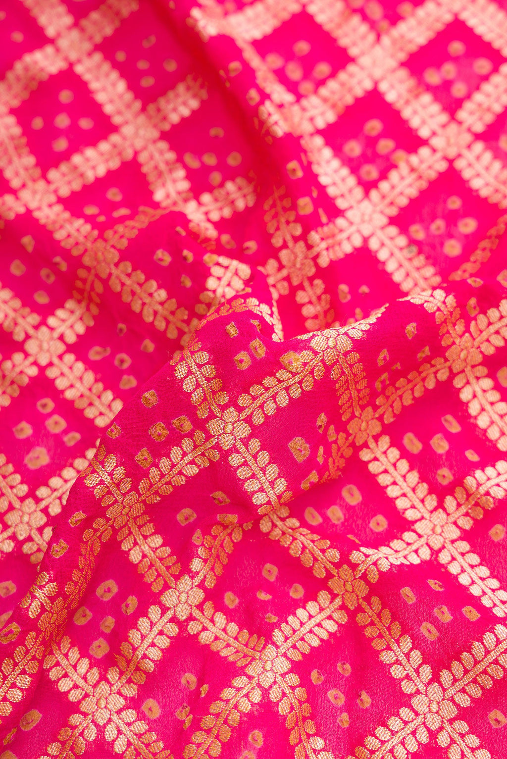 Close up of Pink Dual Tone Banarasi Georgette Saree with Zari Brocade on the body and Zari Border.  displaying folds