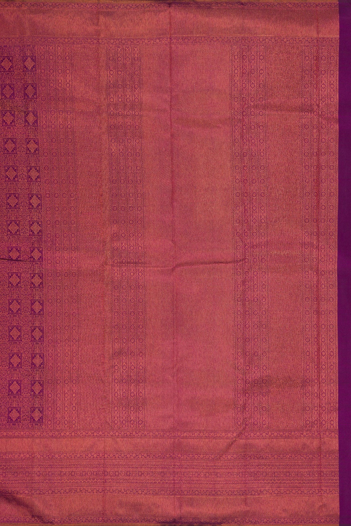 Close up image of the pallu of Purple Dual Tone Kanchipuram Silk Saree with Zari Brocade on the body and Fancy Border. 