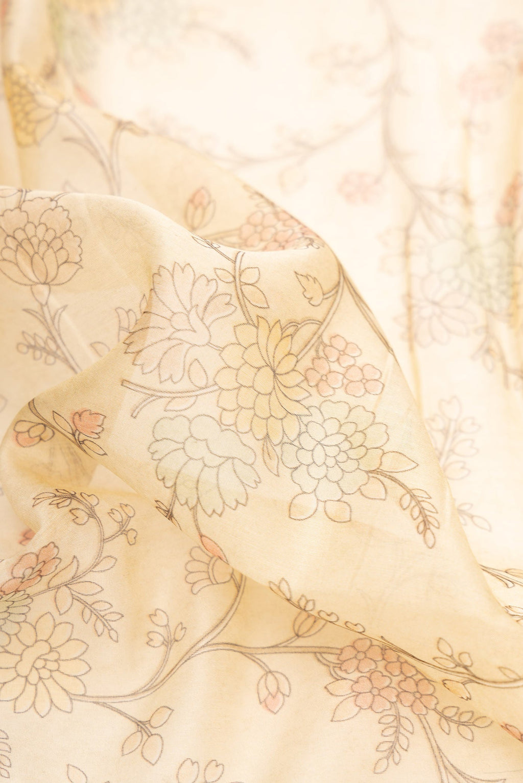 Close up of Sandal Dual Tone Chanderi Silk Saree with Printed design on the body and Embroidery Border.  displaying folds