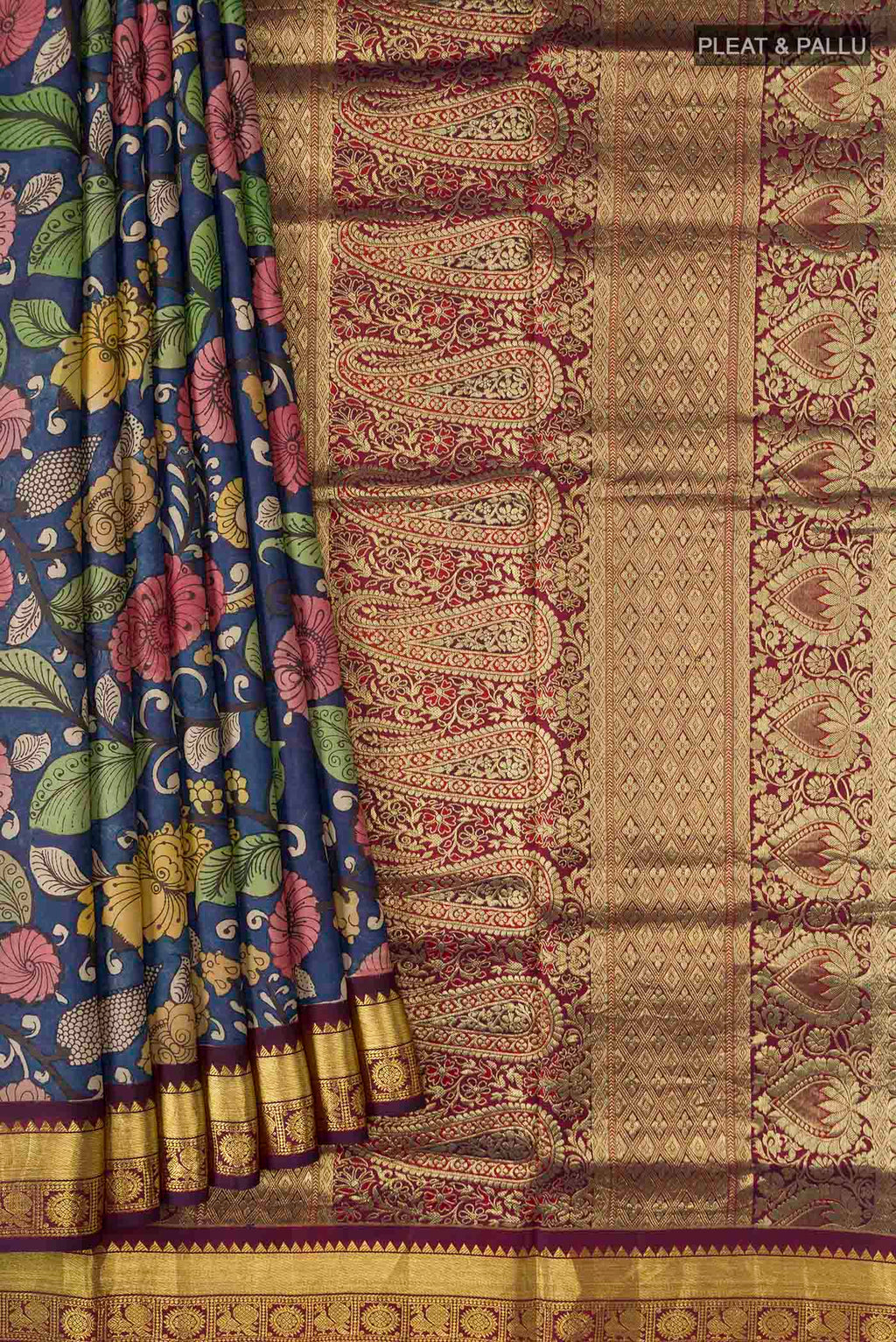 Pleats and pallu of Blue Kanchipuram Silk Saree with Printed design on the body and Zari Border