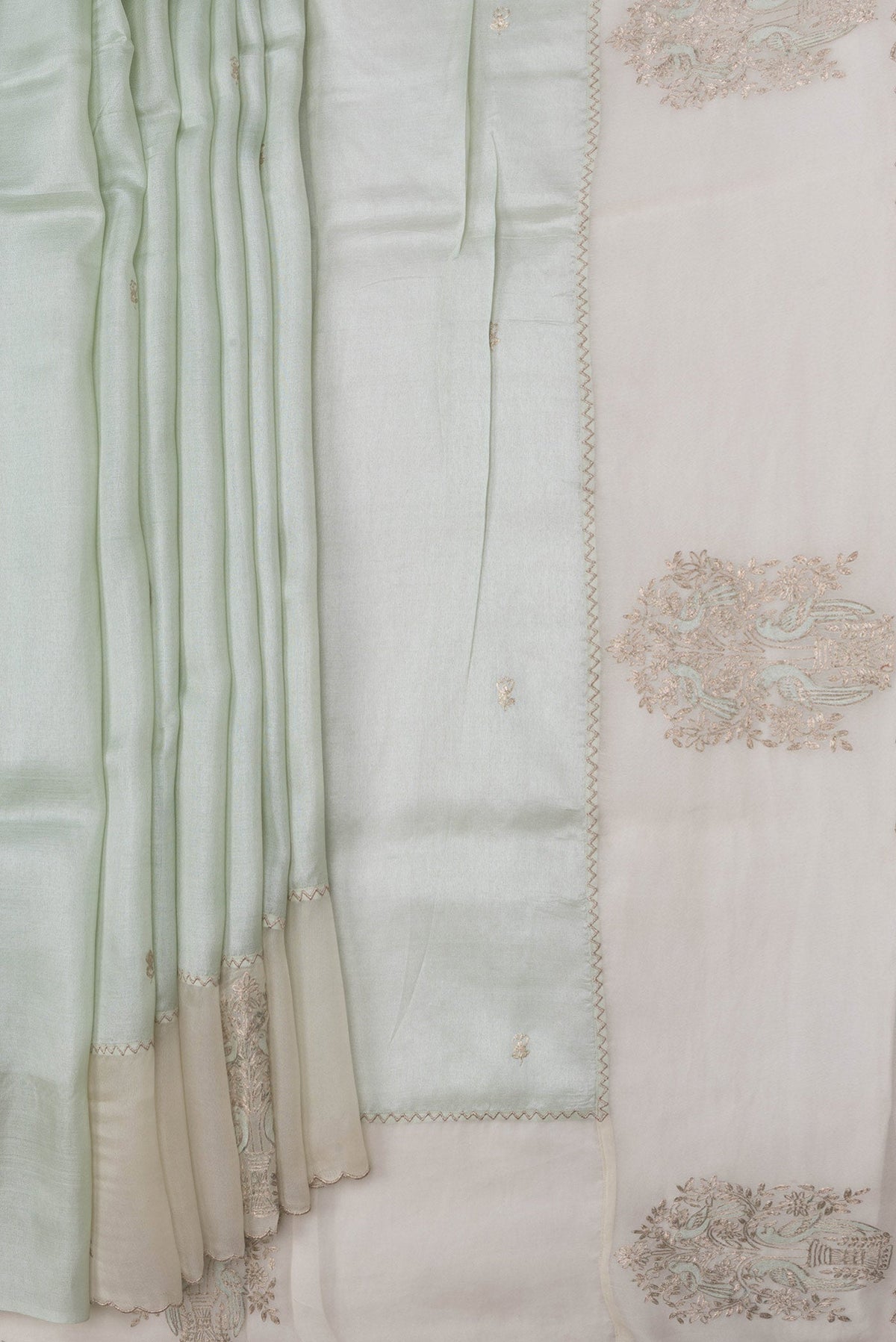 Pleats and pallu of Pista Green Dual Tone Tussar Silk Saree with Embroidery on the body and Fancy Border. 