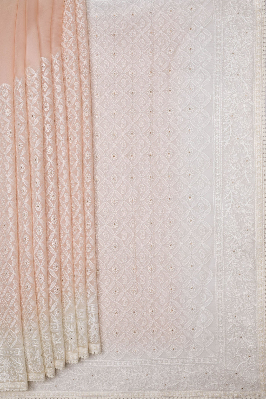 Pleats and pallu of Golden Peach Dual Tone Organza Silk Saree with Embroidery on the body and Embroidery Border. 