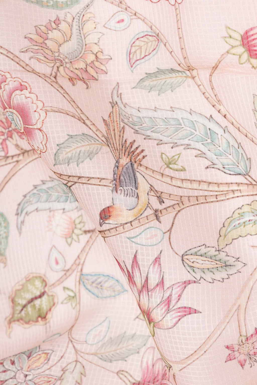 Close up of Golden Peach Dual Tone Kota Silk Saree with Printed design on the body and Embroidery Border displaying folds